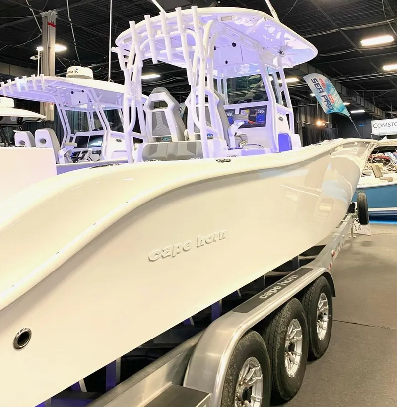Slide: The Image of 2025 Cape Horn 34 XS boat displayed indoors on a trailer. - 30