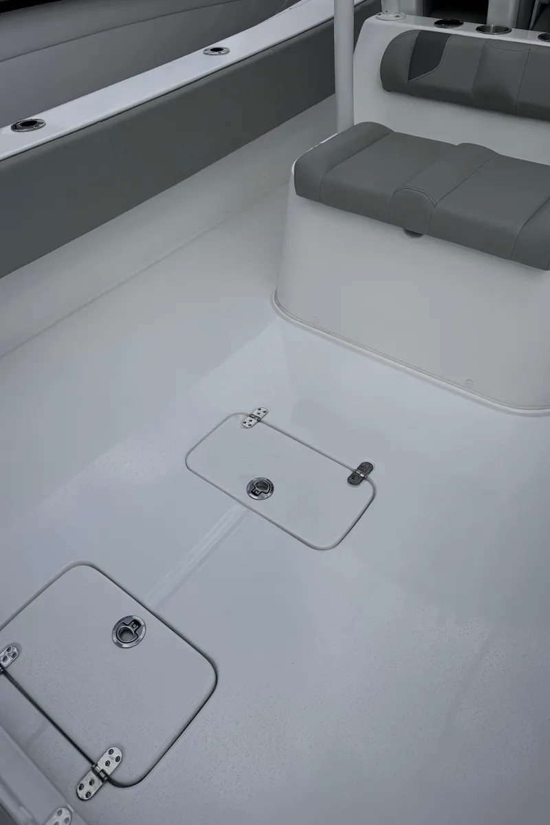 Slide: The Image of 2025 Cape Horn 34 XS boat interior with storage compartments and seating. - 5