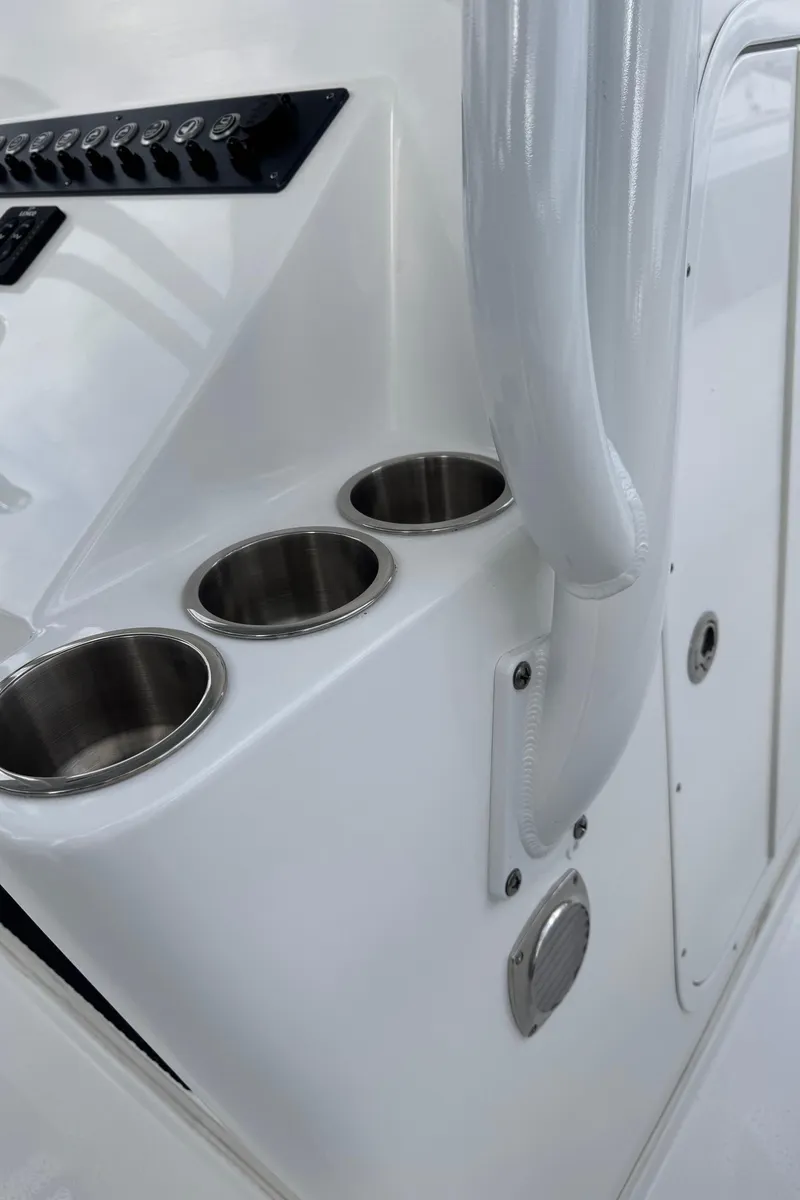 Slide: The Image of 2025 Cape Horn 34 XS boat console with stainless steel cup holders. - 9