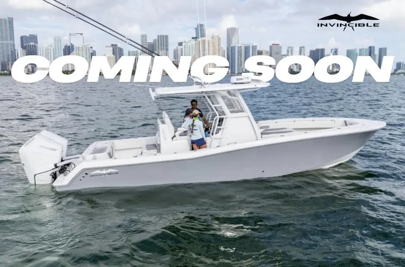 Slide: The Image of 2026 Invincible 33 Open Fisherman boat on water, city skyline background, 'Coming Soon' text. - 0