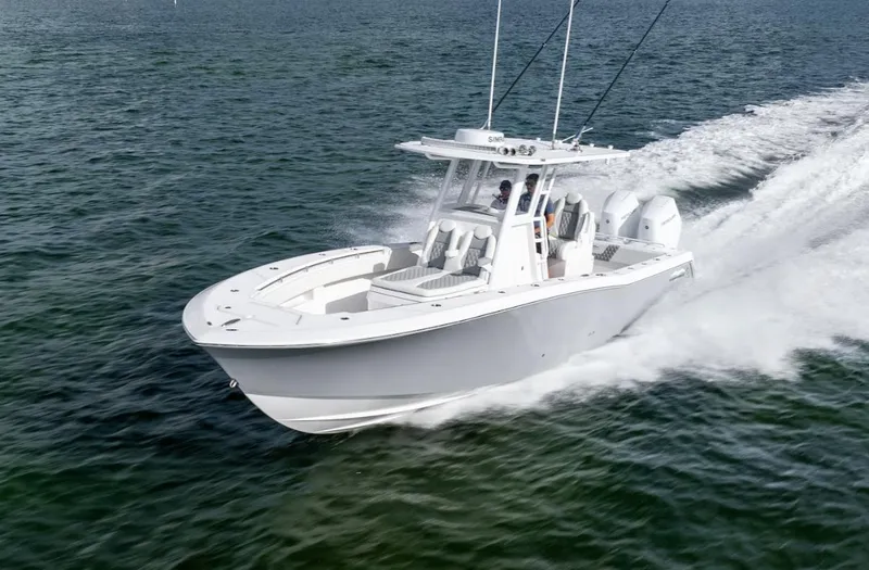 Slide: The Image of 2026 Invincible 33 Open Fisherman boat cruising on open water. - 3