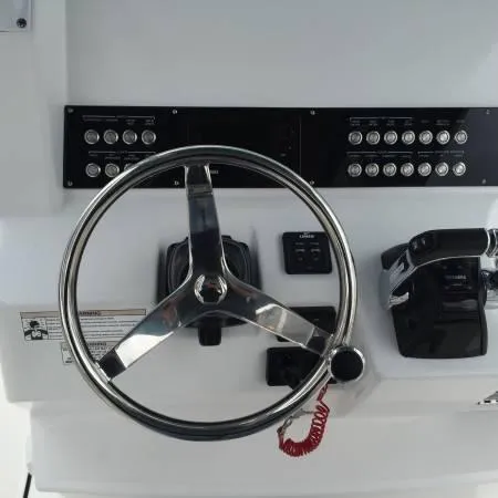 Slide: The Image of Steering console of 2015 Edgewater 280CC boat with control panel and throttle. - 5