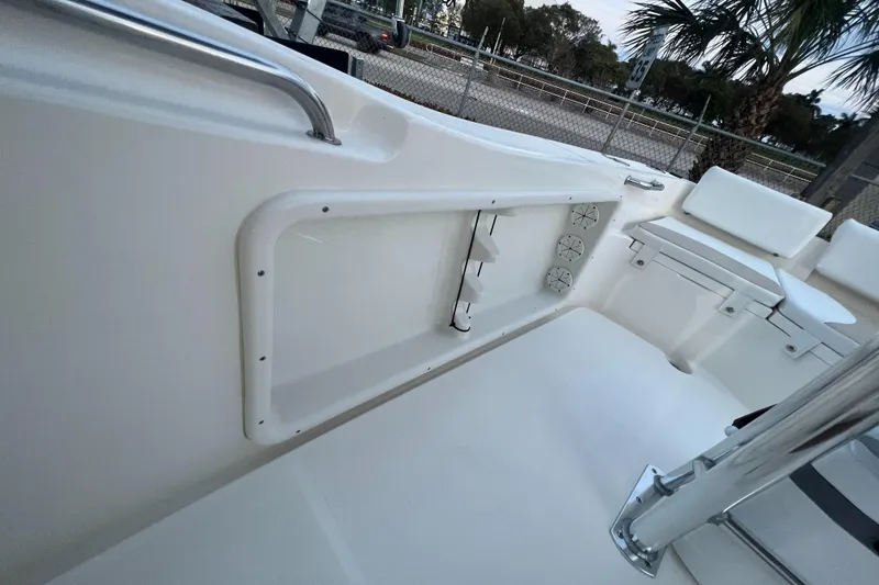 Slide: The Image of 2025 Bulls Bay 200 Center Console boat interior with seating and storage. - 9
