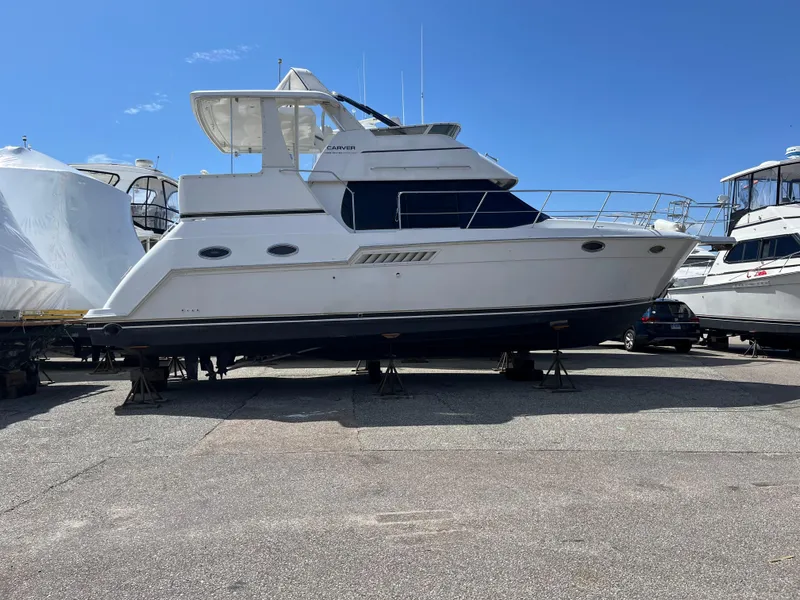 Slide: The Image of 2001 Carver 356 Aft Cabin Motor Yacht on display in a marina. - 4