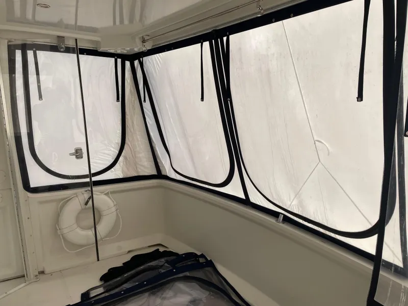 Slide: The Image of 2001 Carver 356 Aft Cabin Motor Yacht interior with large windows and life preserver. - 5