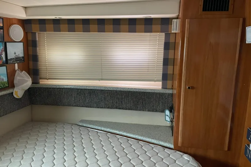 Slide: The Image of Interior cabin of 2001 Carver 356 Aft Cabin Motor Yacht with bed and window blinds. - 12