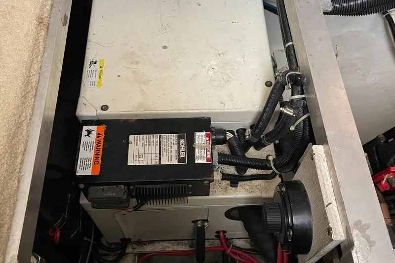 Slide: The Image of Engine compartment of 2001 Carver 356 Aft Cabin Motor Yacht with wiring and components. - 19