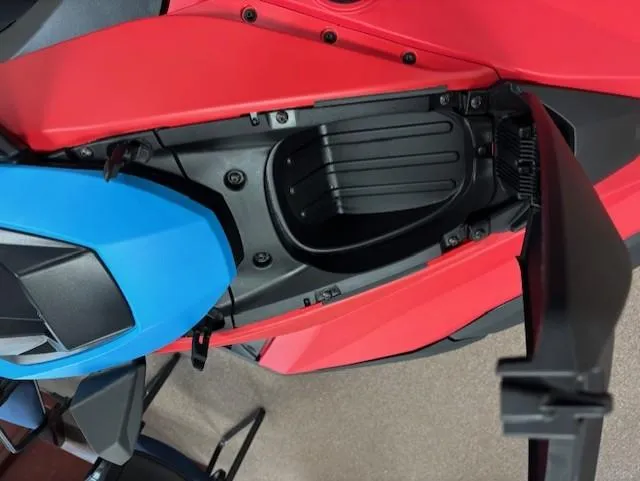 Slide: The Image of 2025 Yamaha WaveRunner JetBlaster DLX 3-Up storage compartment, red and blue design. - 4