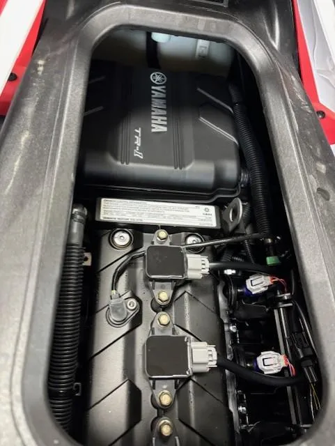 Slide: The Image of 2025 Yamaha WaveRunner JetBlaster DLX 3-Up engine compartment, showcasing internal components and wiring. - 8