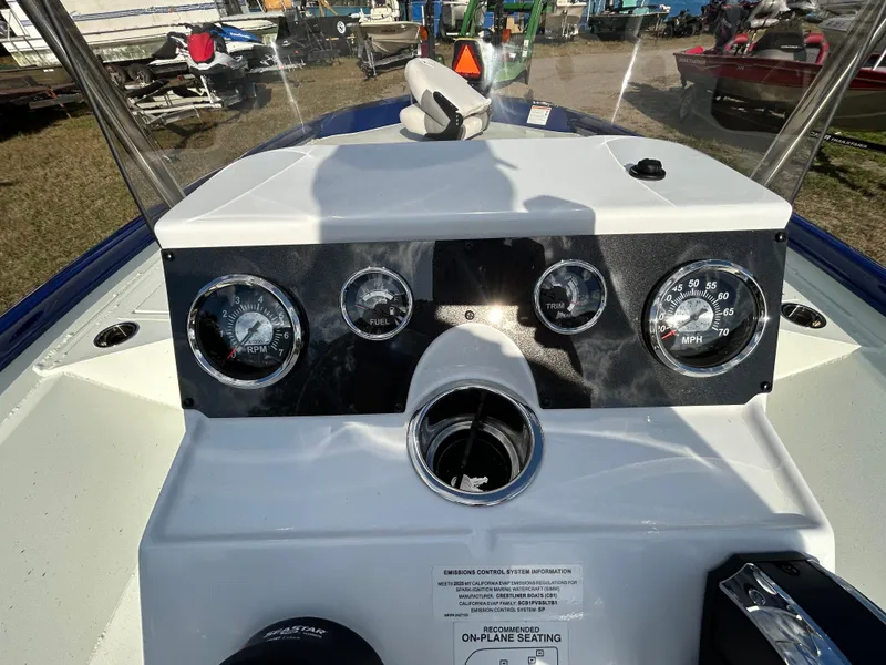 Slide: The Image of Dashboard of 2025 Crestliner 2000 Bay boat with gauges and controls. - 10