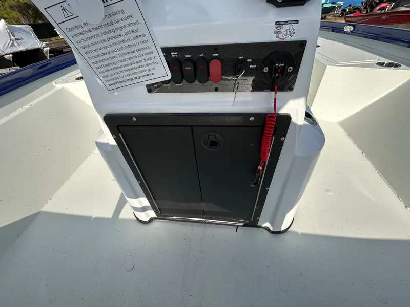 Slide: The Image of 2025 Crestliner 2000 Bay boat console with control panel and safety features. - 11