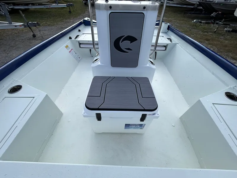Slide: The Image of 2025 Crestliner 2000 Bay boat interior with seating and storage compartments. - 17