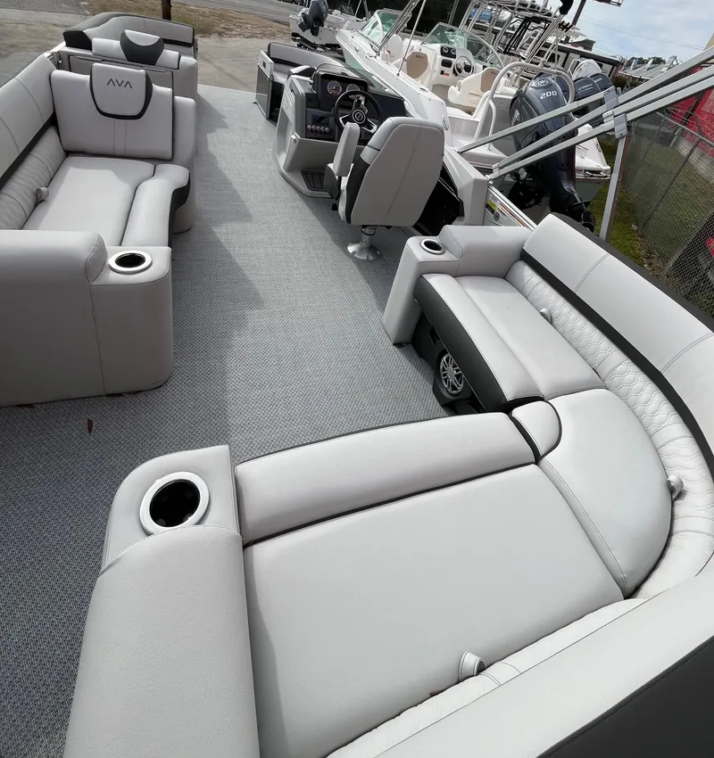 Slide: The Image of 2024 Avalon Catalina Elite 23' pontoon boat interior with luxurious seating and modern design. - 10
