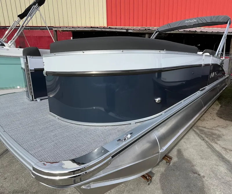 Slide: The Image of 2024 Avalon Catalina Elite 23' pontoon boat with sleek design and modern features. - 2