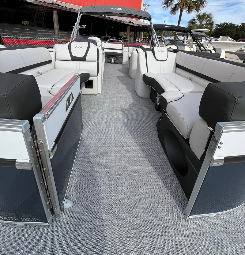 Slide: The Image of 2024 Avalon Catalina Elite 23' pontoon boat with spacious seating and modern design. - 6