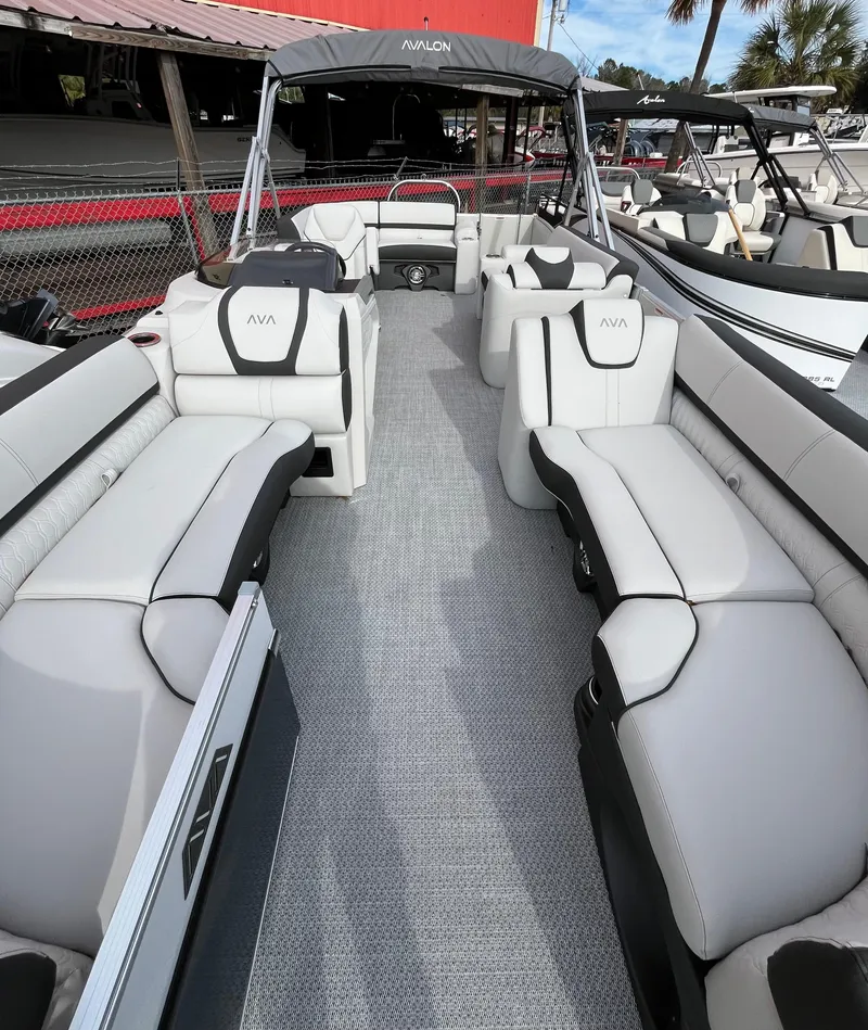 Slide: The Image of 2024 Avalon Catalina Elite 23' pontoon boat with luxurious seating and modern design. - 7