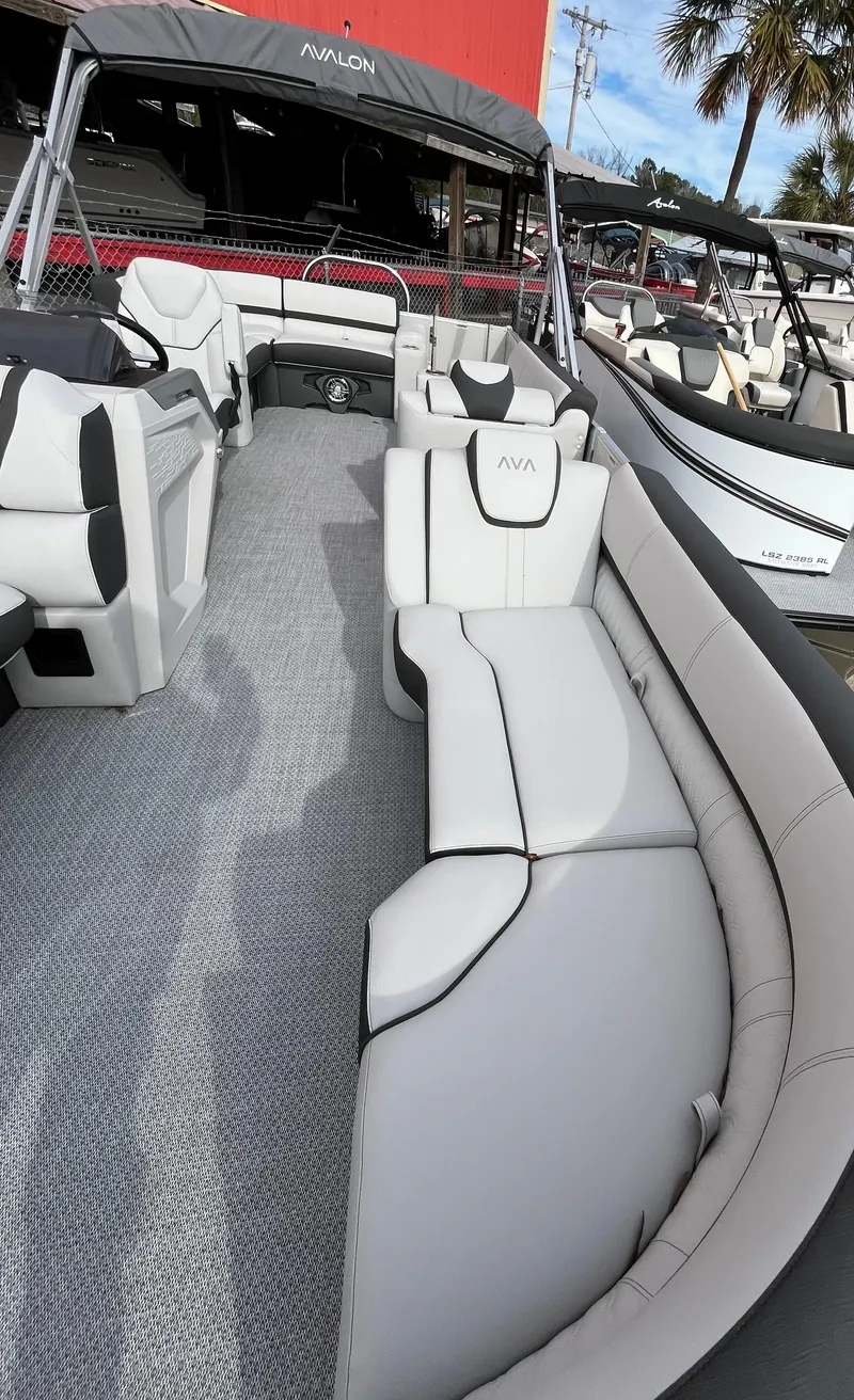 Slide: The Image of 2024 Avalon Catalina Elite 23' pontoon boat with luxurious seating and modern design. - 8