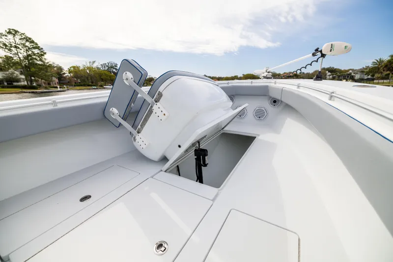 Slide: The Image of 2022 Contender 35ST boat interior with storage compartment and seating. - 21