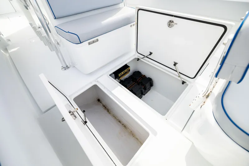 Slide: The Image of Contender 35ST 2022 boat storage compartments with open hatches and seating. - 22