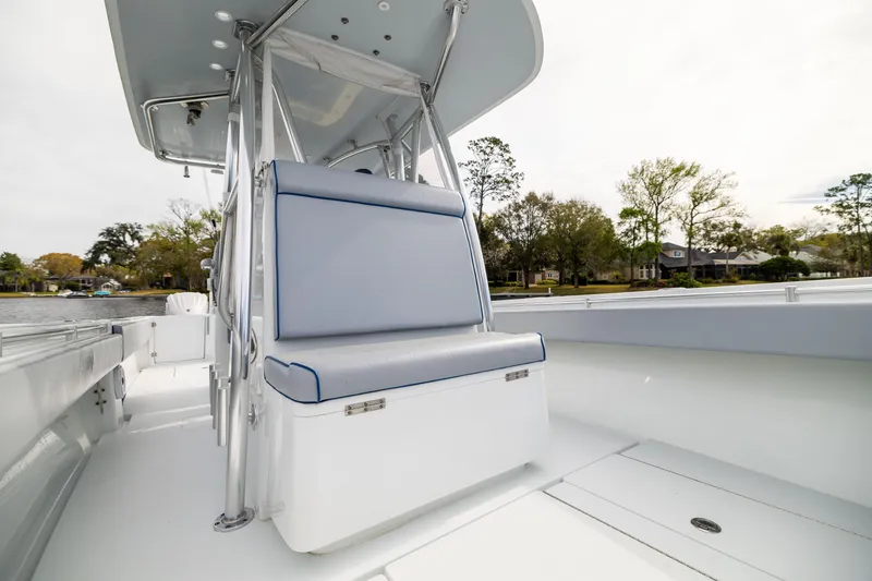 Slide: The Image of 2022 Contender 35ST boat interior with cushioned seating and sleek design. - 23