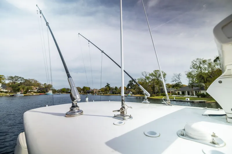 Slide: The Image of 2022 Contender 35ST boat with fishing rods on a calm river. - 26