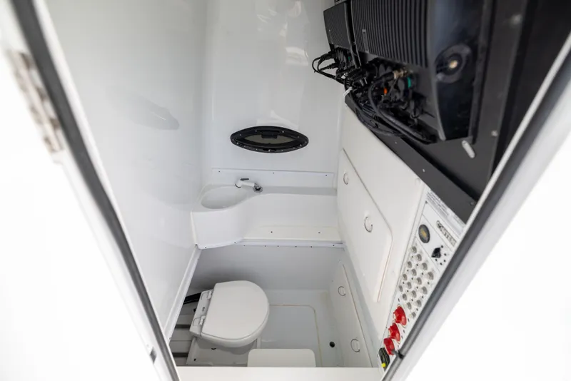 Slide: The Image of 2022 Contender 35ST boat interior with toilet and control panel. - 27