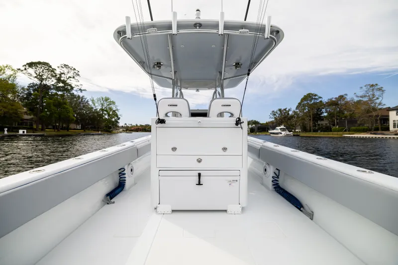 Slide: The Image of 2022 Contender 35ST boat interior with center console on a calm waterway. - 43