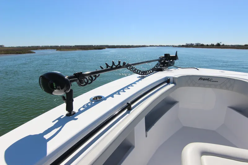 Slide: The Image of 2024 Front Runner 33 Center Console boat on calm water, featuring sleek design and advanced equipment. - 15