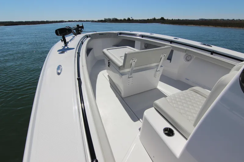 Slide: The Image of 2024 Front Runner 33 Center Console boat interior on calm water. - 18