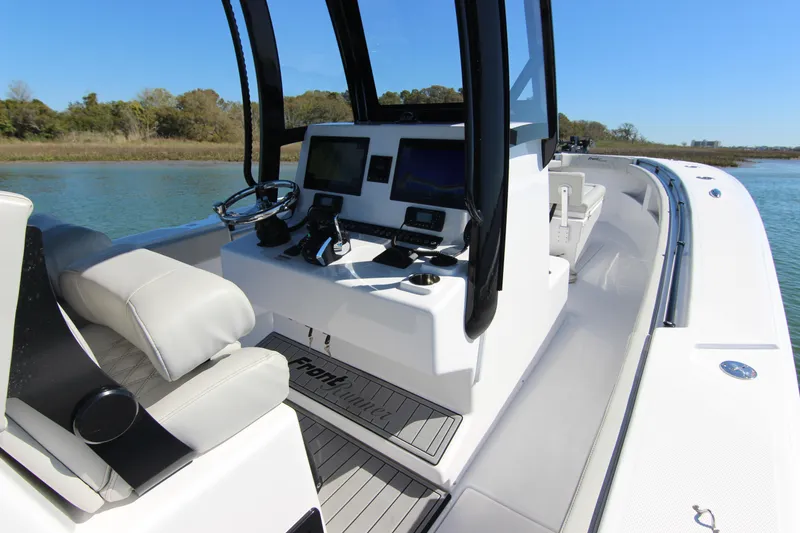 Slide: The Image of 2024 Front Runner 33 Center Console boat interior with modern navigation equipment. - 23
