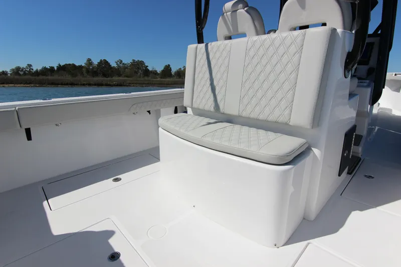 Slide: The Image of 2024 Front Runner 33 Center Console boat interior with cushioned seating. - 26