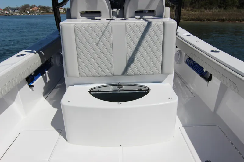 Slide: The Image of 2024 Front Runner 33 Center Console boat interior with seating and storage. - 27