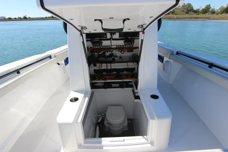 Slide: The Image of 2024 Front Runner 33 Center Console boat interior with open hatch and visible wiring. - 28
