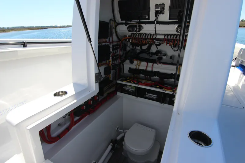 Slide: The Image of 2024 Front Runner 33 Center Console boat interior with wiring and toilet. - 29