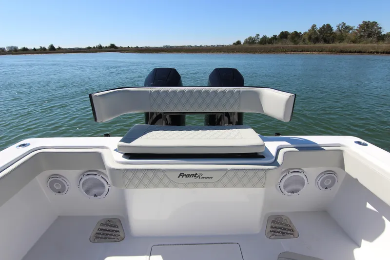 Slide: The Image of 2024 Front Runner 33 Center Console boat on calm water, rear view. - 31