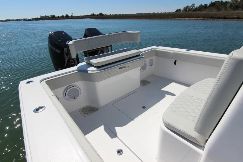 Slide: The Image of 2024 Front Runner 33 Center Console boat interior with seating and water view. - 33