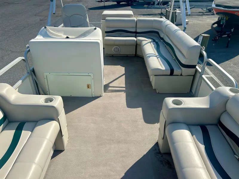 Slide: The Image of 2003 Odyssey Pontoons 2101 Millennium interior with spacious seating and cup holders. - 11
