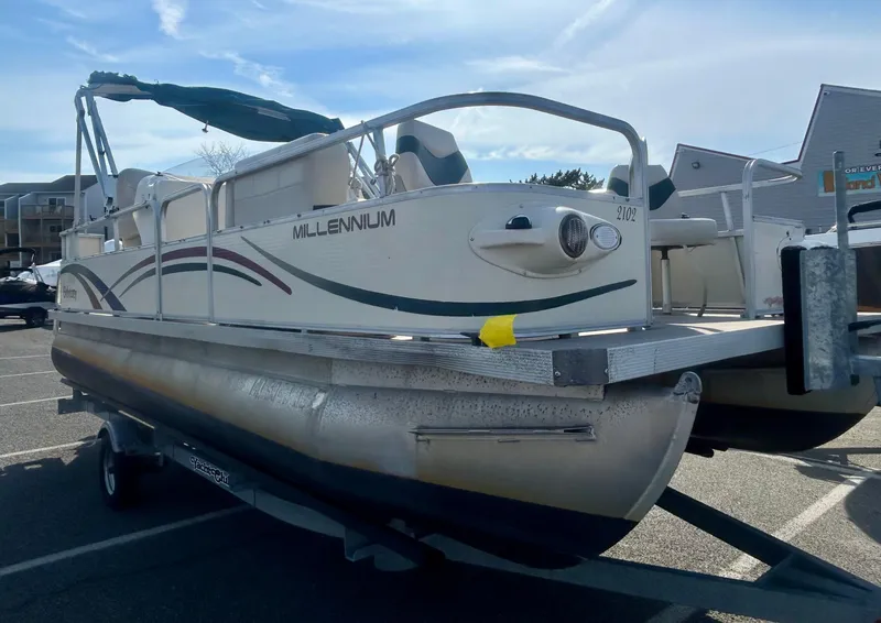 Slide: The Image of 2003 Odyssey Pontoons 2101 Millennium boat on trailer in parking lot. - 3