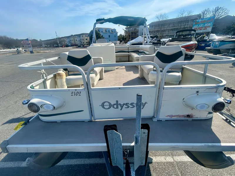 Slide: The Image of 2003 Odyssey Pontoons 2101 Millennium boat parked in a marina lot. - 5