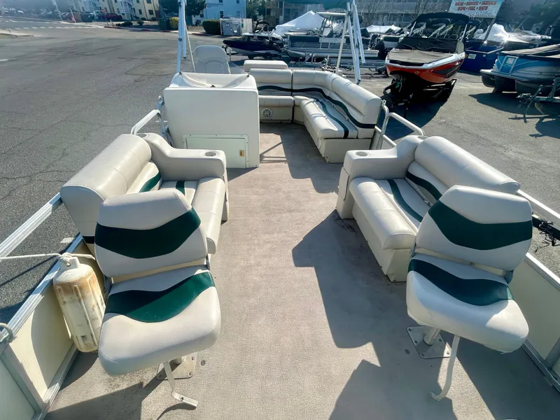 Slide: The Image of 2003 Odyssey Pontoons 2101 Millennium with spacious seating and clean interior. - 9