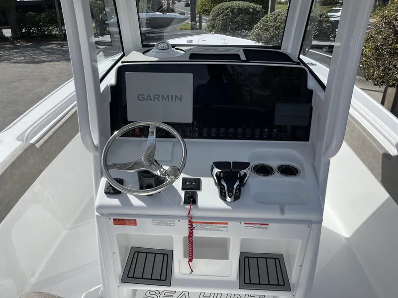 Slide: The Image of 2025 Sea Hunt Ultra 265 SE boat console with Garmin navigation system. - 11