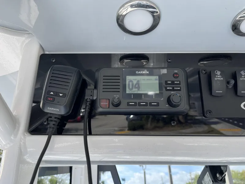 Slide: The Image of Garmin marine radio on 2025 Sea Hunt Ultra 265 SE dashboard. - 15