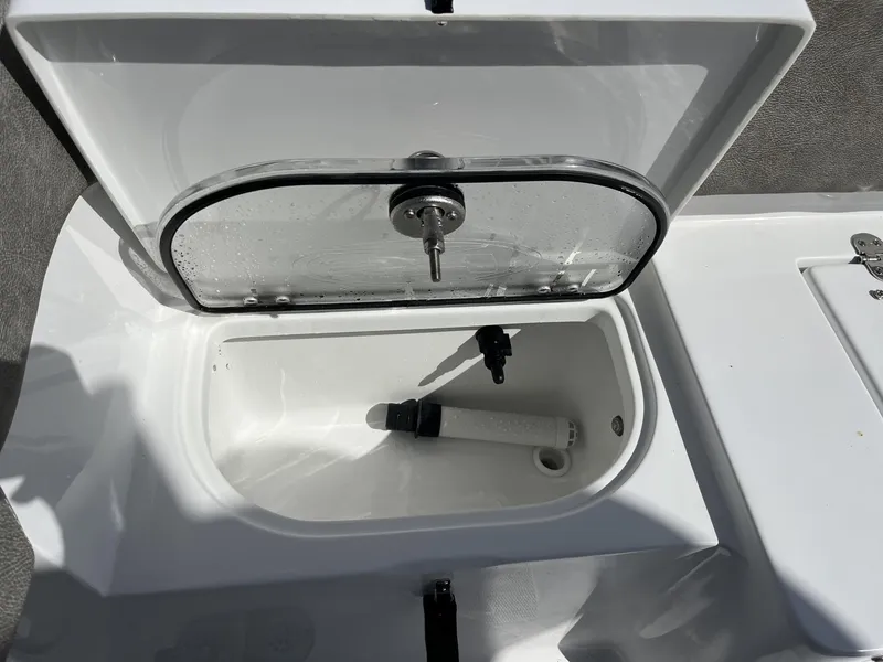 Slide: The Image of Open storage compartment on 2025 Sea Hunt Ultra 265 SE boat. - 30