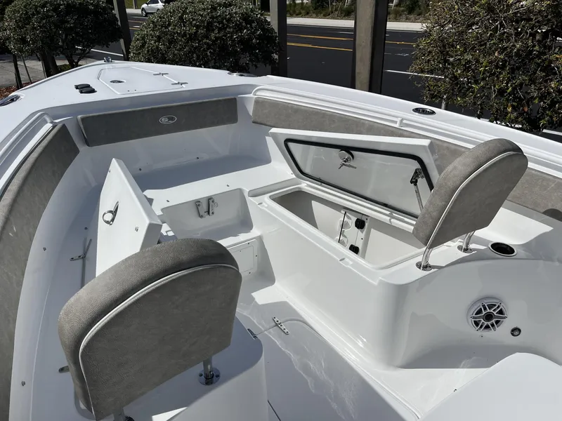 Slide: The Image of 2025 Sea Hunt Ultra 265 SE boat interior with seating and storage compartments. - 17