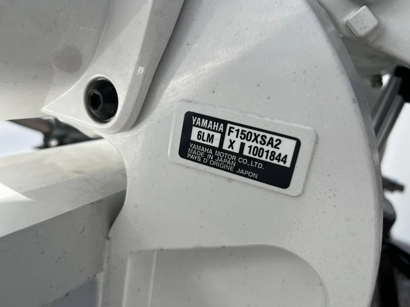 Slide: The Image of Close-up of Yamaha F150XSA2 engine label on 2025 Sea Hunt Ultra 265 SE boat. - 9