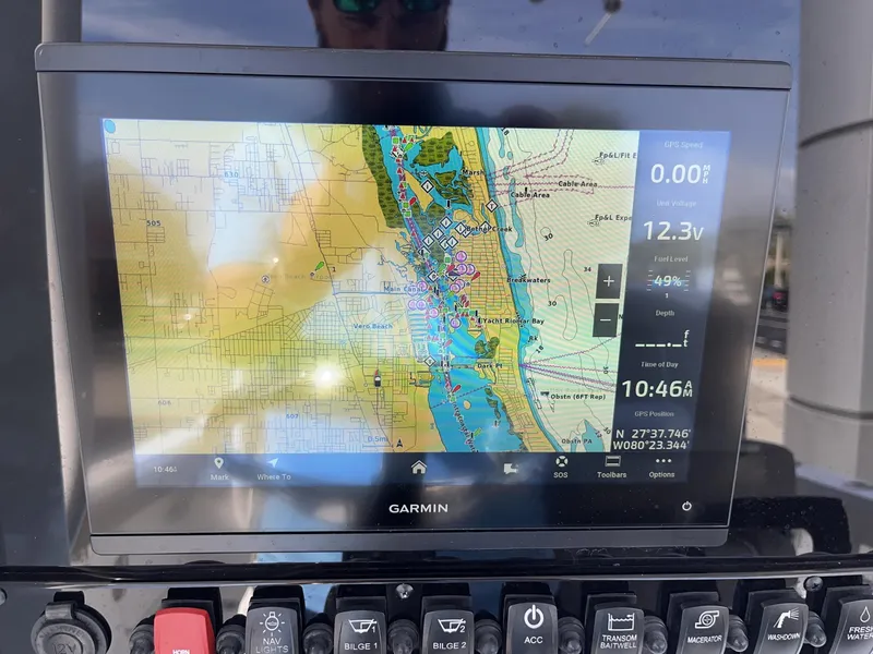 Slide: The Image of Garmin GPS display on 2025 Sea Hunt Ultra 265 SE boat, showing navigation map and data. - 12