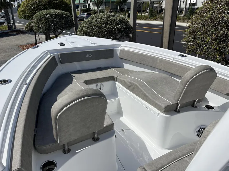 Slide: The Image of 2025 Sea Hunt Ultra 265 SE boat interior with cushioned seating and modern design. - 19