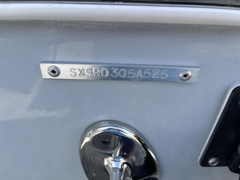 Slide: The Image of 2025 Sea Hunt Ultra 265 SE boat hull identification number plate. - 8