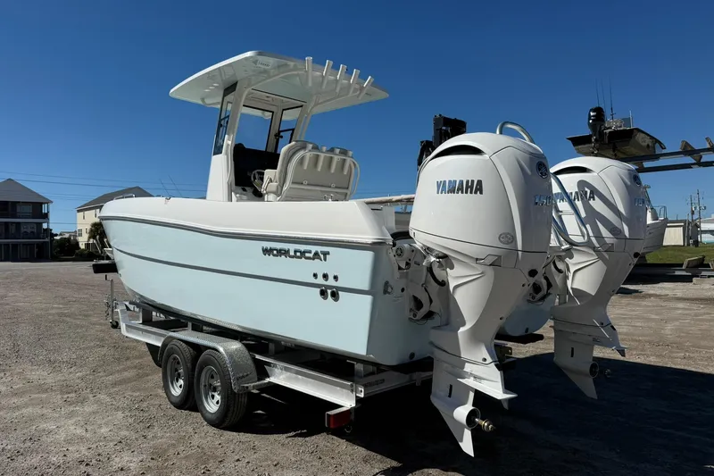 Slide: The Image of 2026 World Cat 235 TE boat with twin Yamaha engines on a trailer. - 25