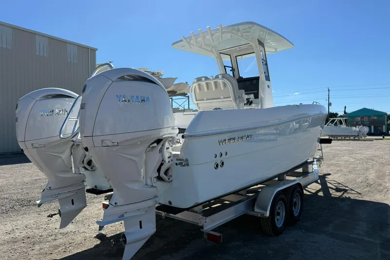 Slide: The Image of 2026 World Cat 235 TE boat with dual Yamaha engines on a trailer. - 27